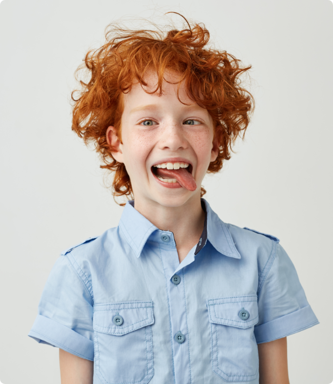 Kid with a funny face after metal braces with Moroco Orthodontics