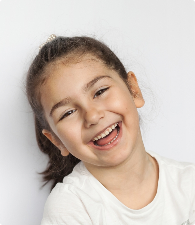 Smiling kid after interceptive treatment at Moroco Orthodontics Delray Beach