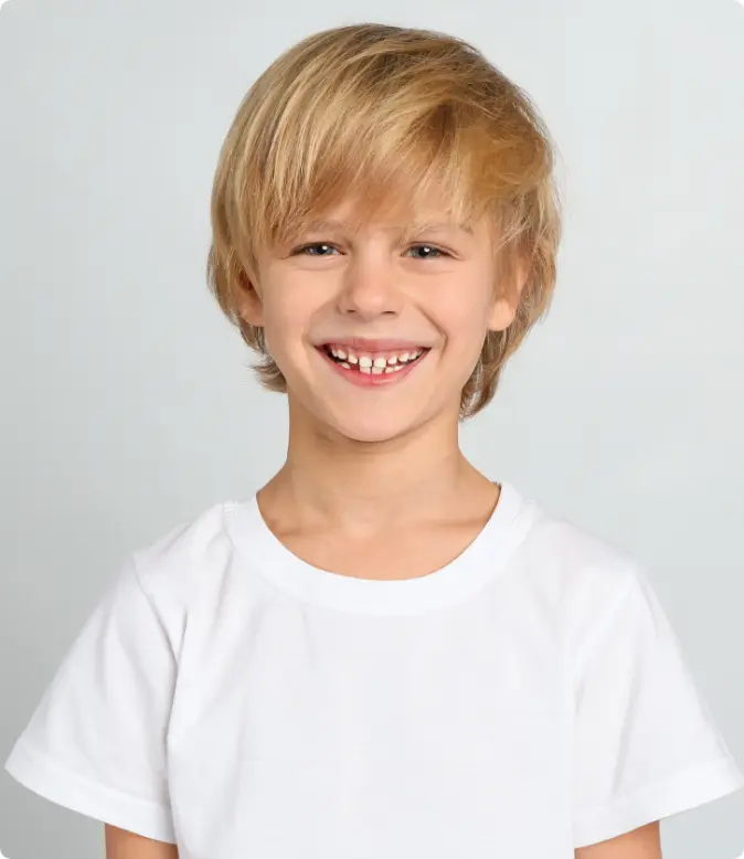 Happy child after interceptive orthodontic treatment at Moroco Orthodontics in Delray Beach